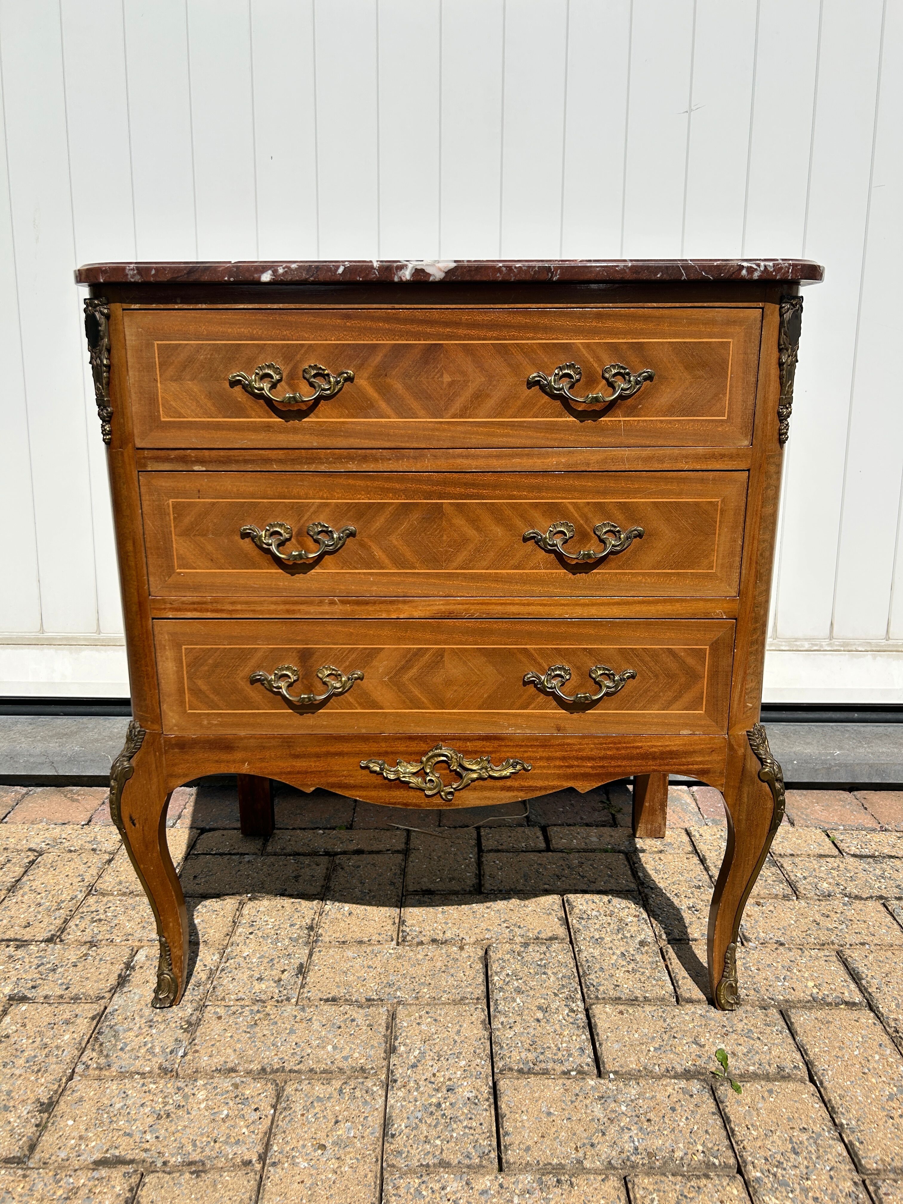 Marquetry commode in transitional style