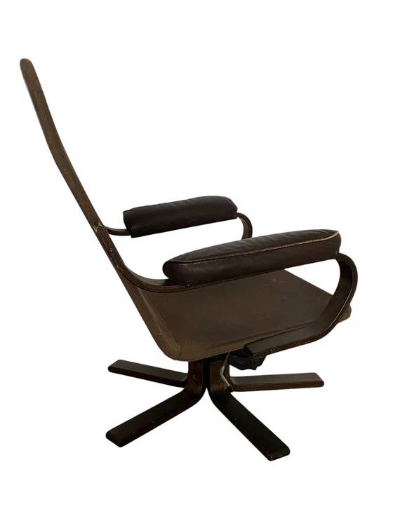 Vintage Scandinavian armchair in curved wood and leather
