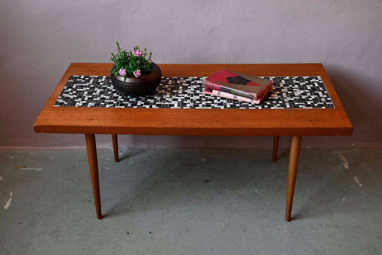 1970s coffee table with a tapered teak base and ceramic mosaic.