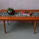 1970s coffee table with a tapered teak base and ceramic mosaic.