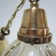 Holophane glass suspension and vintage patinated brass