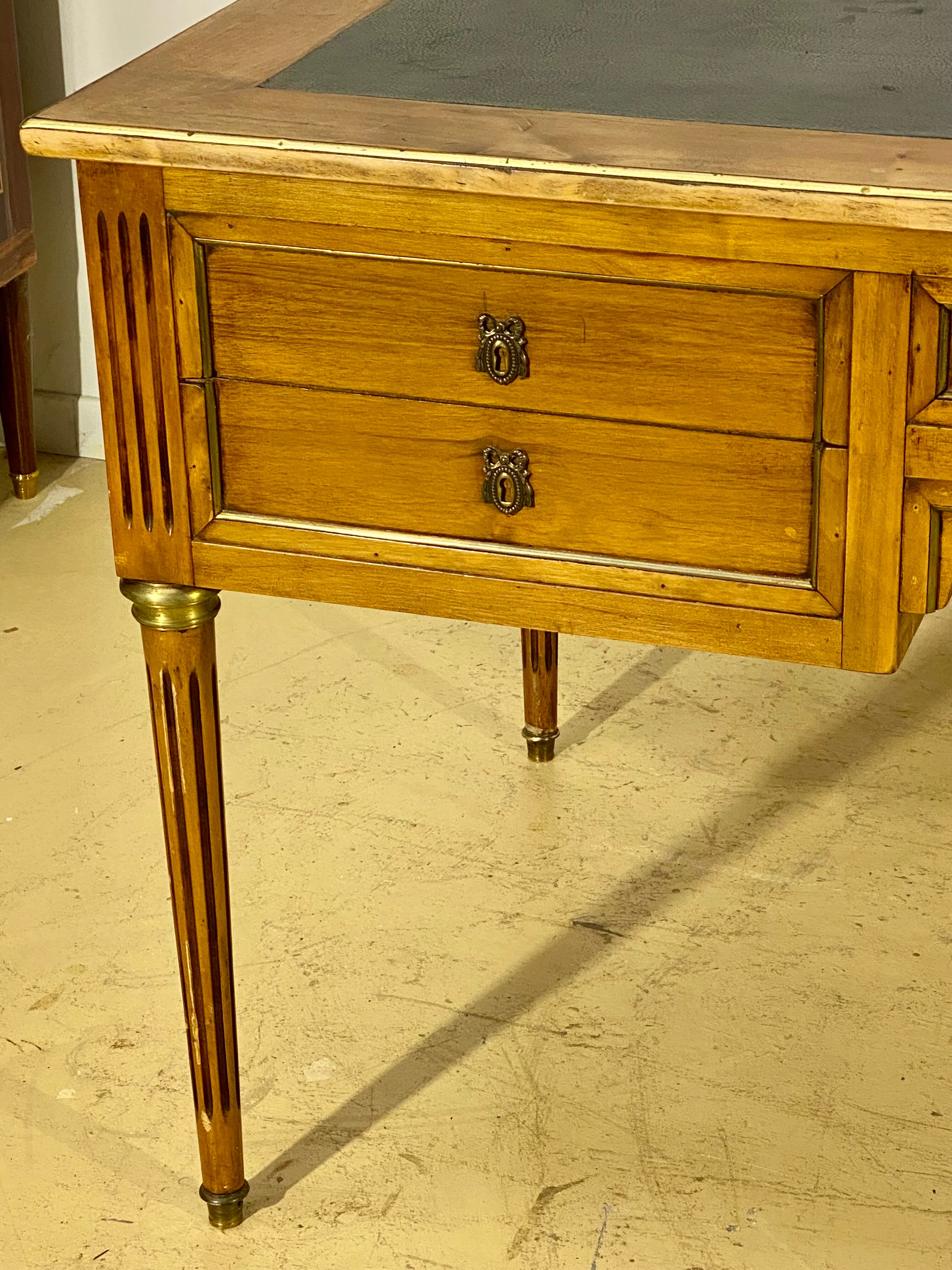 Louis XVI style desk in walnut veneer and brass fillets