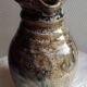 Enamelled ceramic pitcher, signature mb the terminal