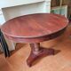 Round table with central tripod leg