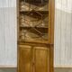 19th-century English corner cabinet in oak, mahogany, and fir.