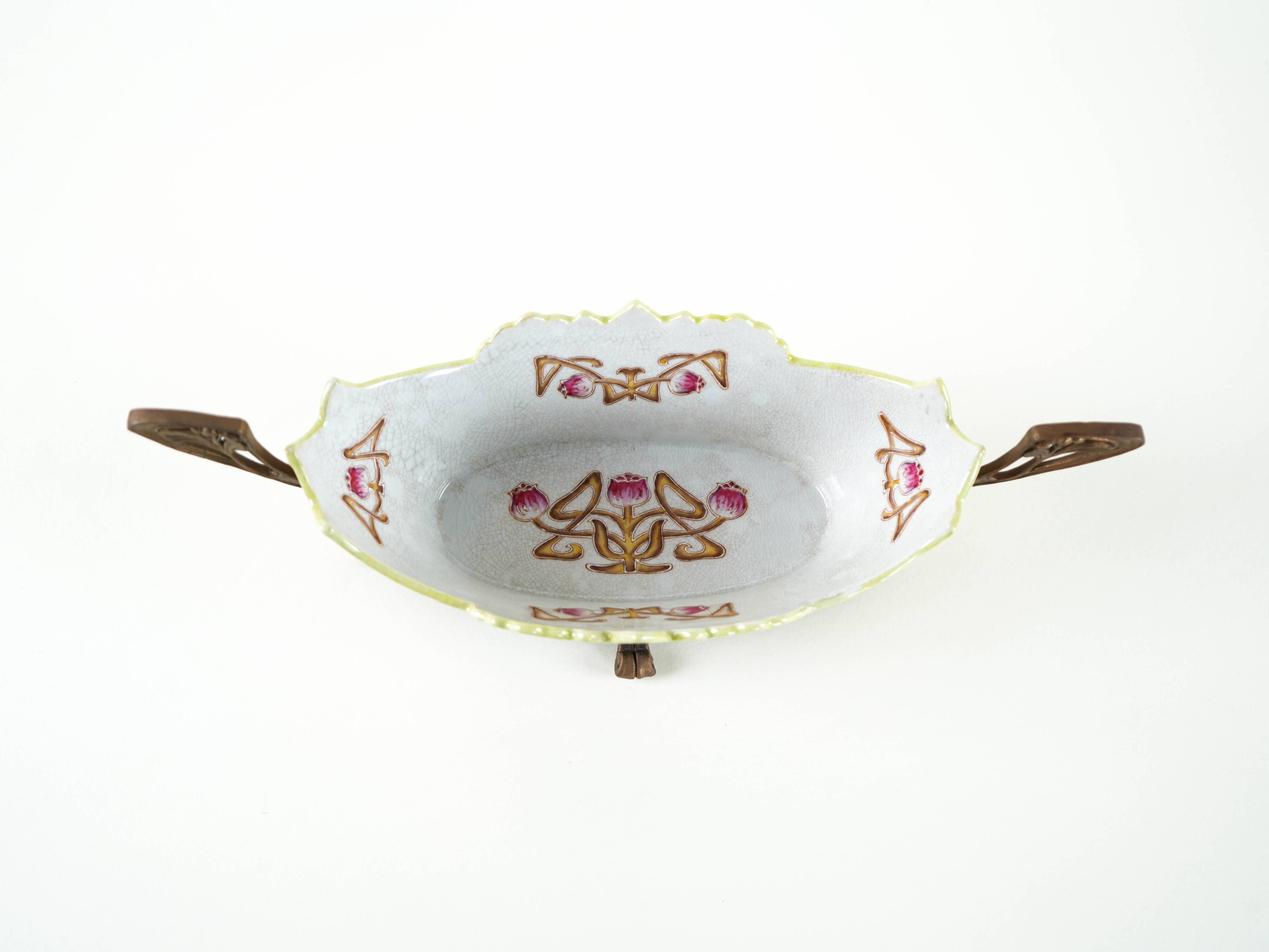Art Nouveau ceramic platter with glazed golden finish in decorative metal frame, European