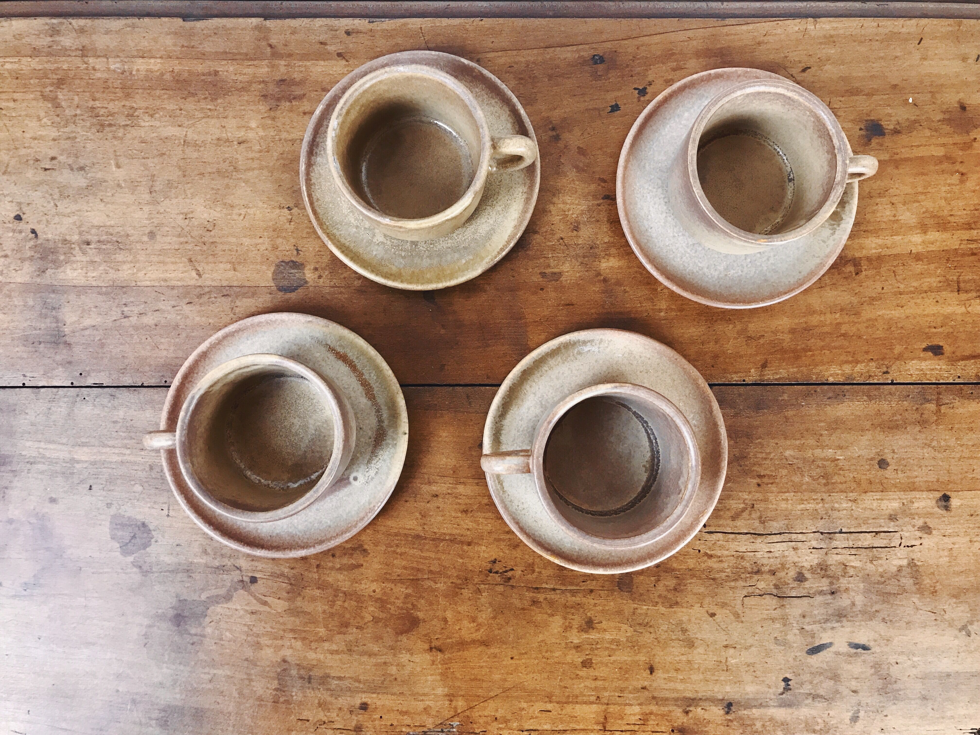 4 sandstone cups with under cups