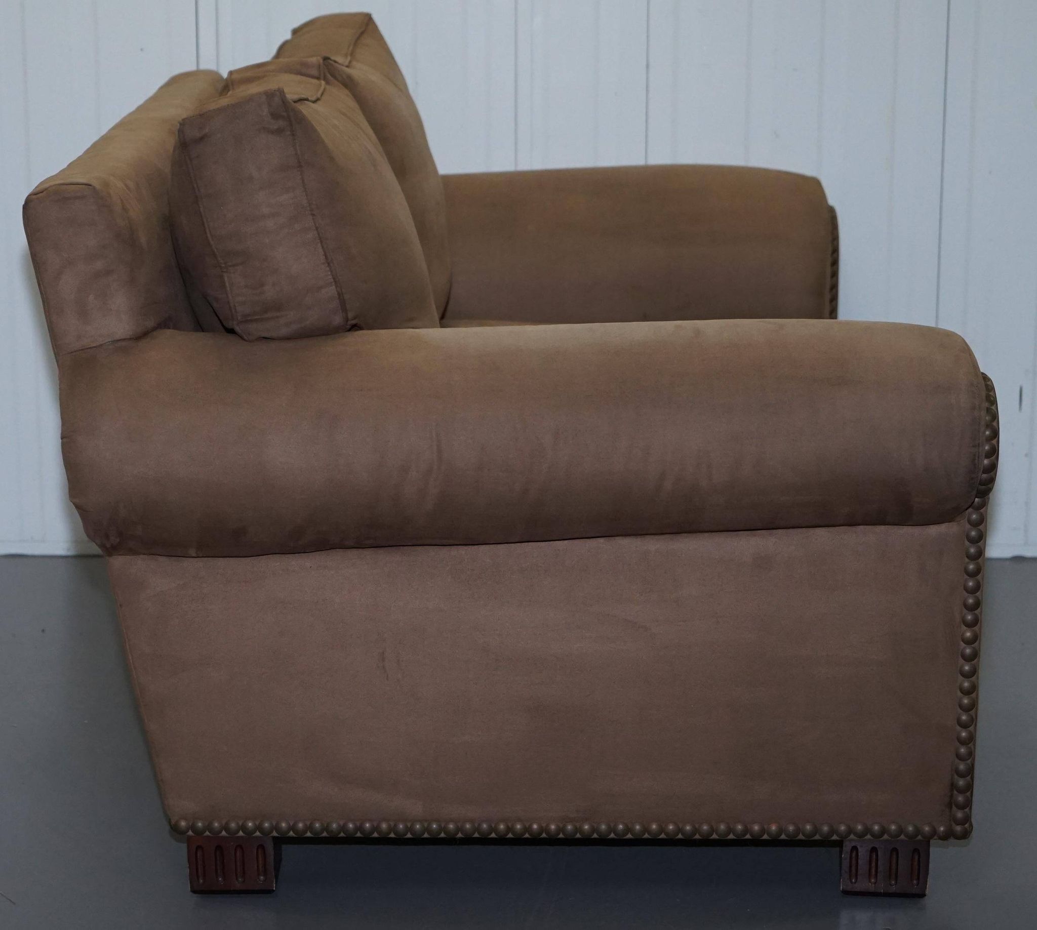 Ralph Lauren Jamaica velvet sofa pair with feather cushions.
