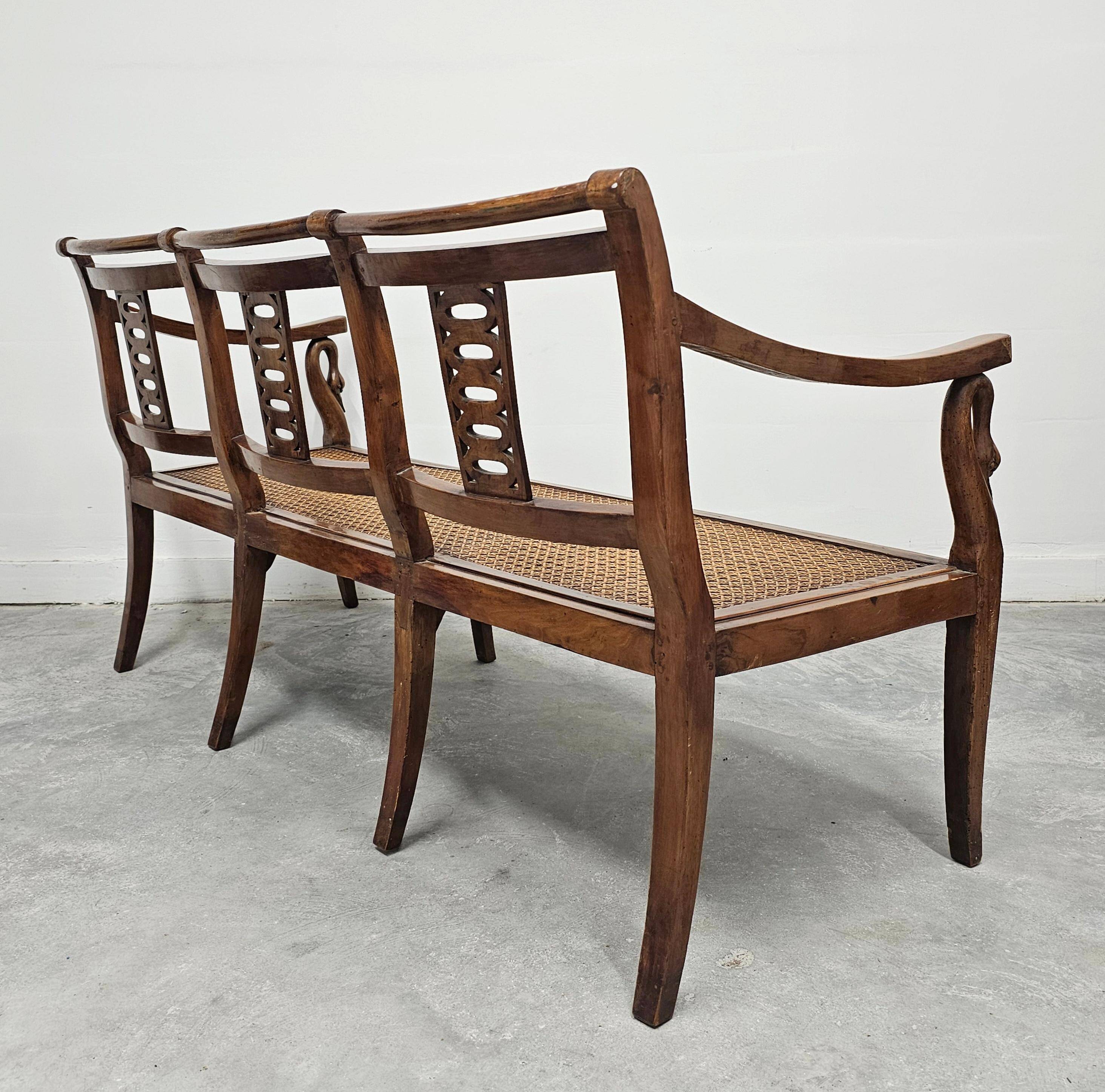Directoire canapé in walnut with brass inlays, late 18th century.