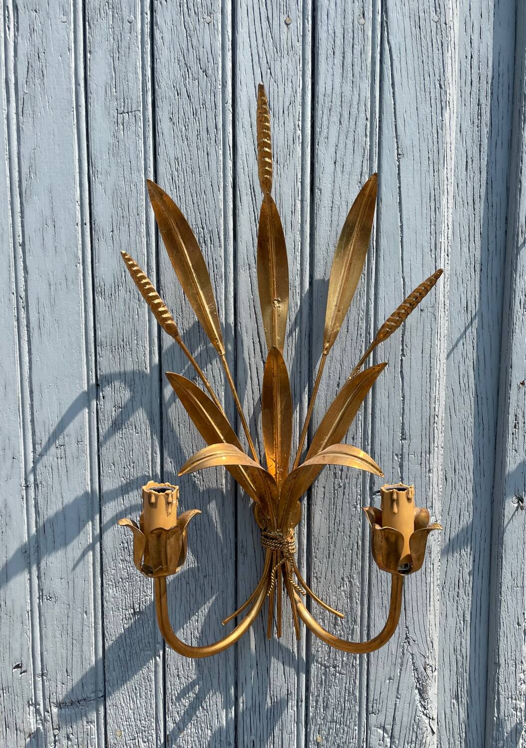 Pair of wall sconces in the shape of a wheat sheaf with two lights.