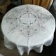 Round off-white tablecloth embroidered with grey flowers with 8 matching napkins - festive table