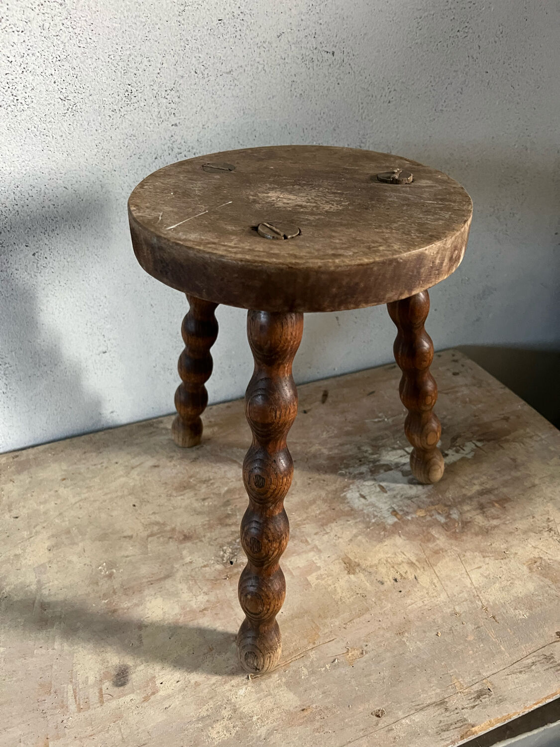 Wooden tripod stool