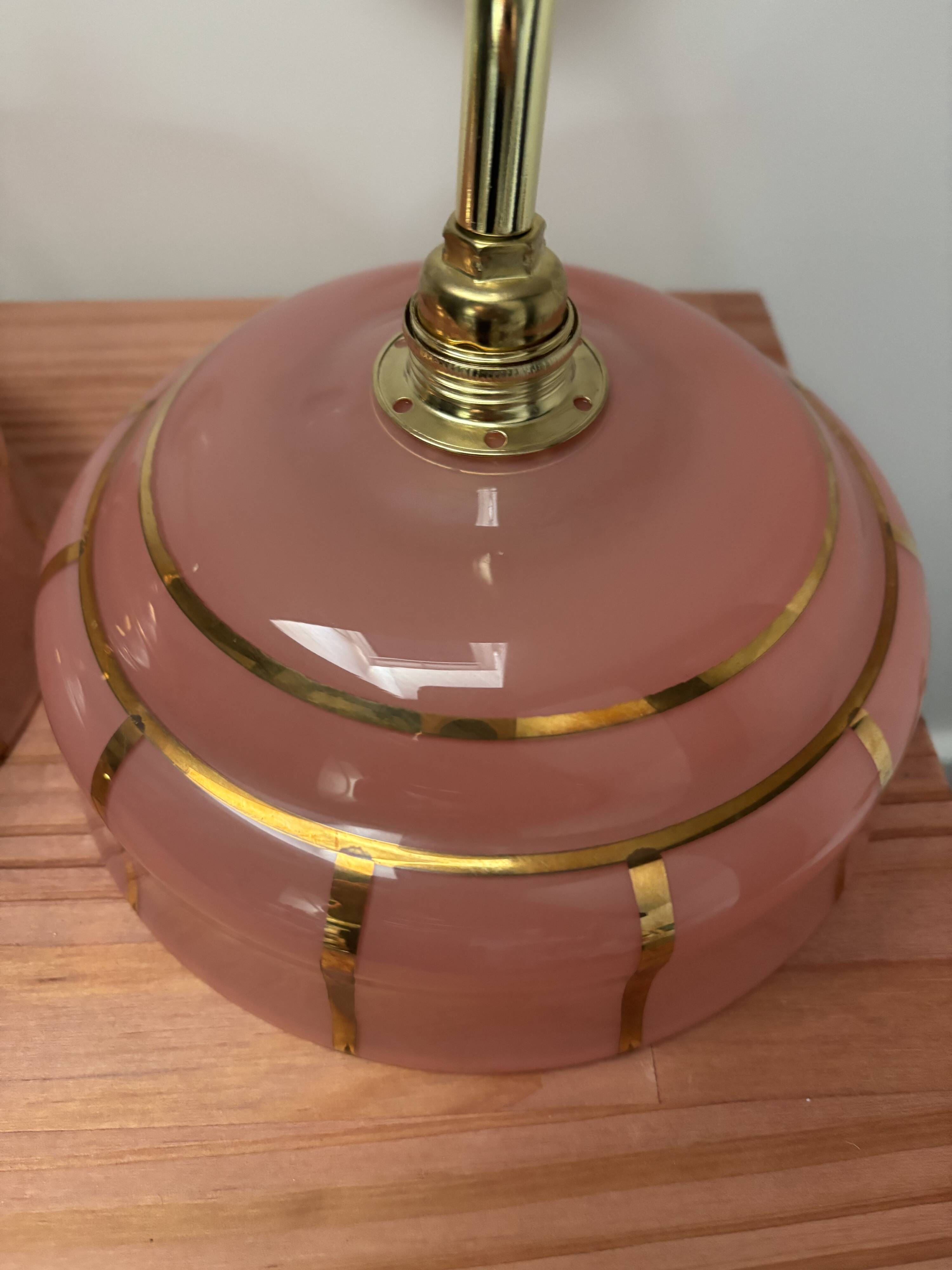 Pair of white ceramic wall lights with pink glass