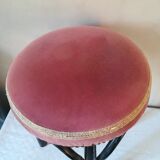 Black stool sitting in velvet rose