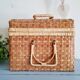Small suitcase in vintage rattan trunk