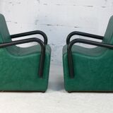 Pair of armrest heaters. Steel and green imitation leather. France, circa 1980