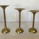 Trio of brass tulip foot candle holders
