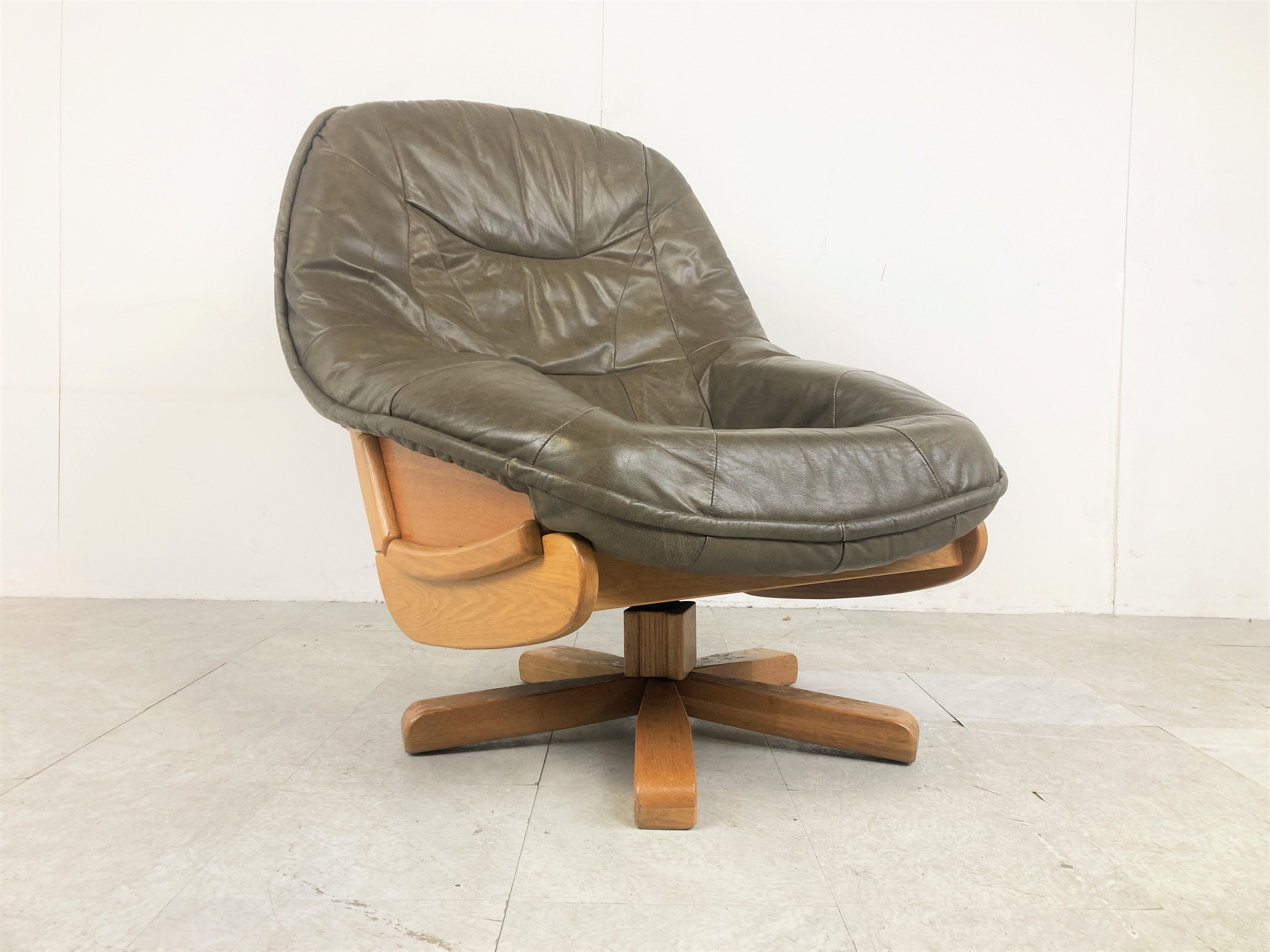 Brutalist oak and leather swivel chair, 1970s
