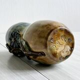 Very colorful glazed earthenware vase, old vase with floral decoration.