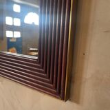 Mirror in wood and brass