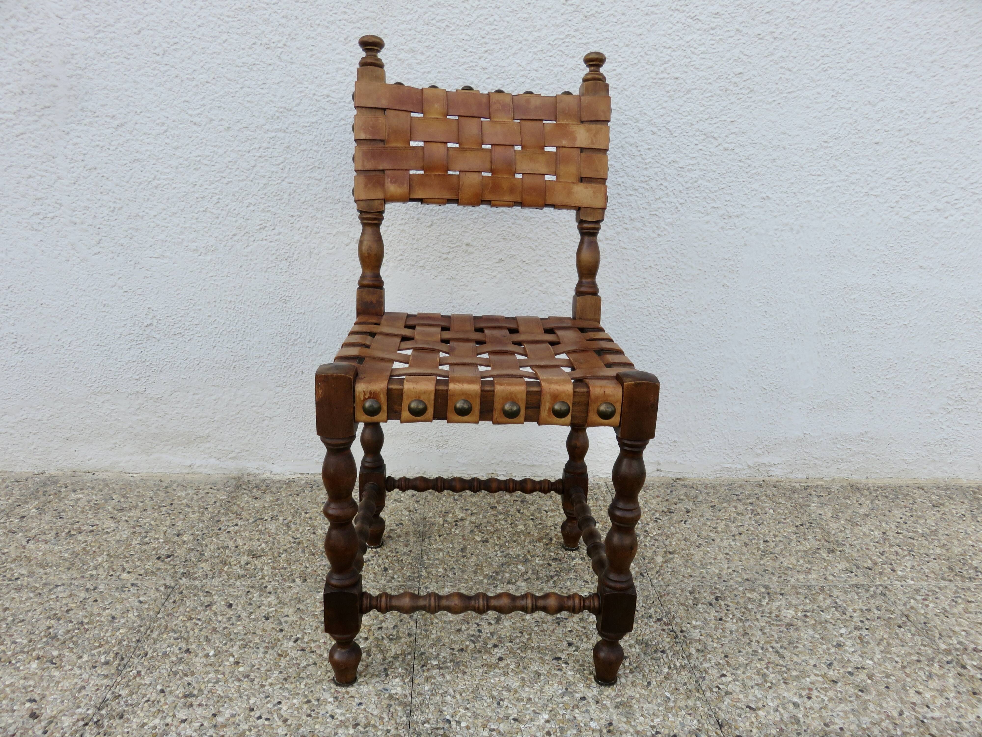 Spanish chair in oak with thick cognac leather straps, 1940s.