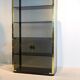 Armoire en verre fumé et laiton