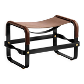 Smoky steel footrest in black and dark brown leather, contemporary style.