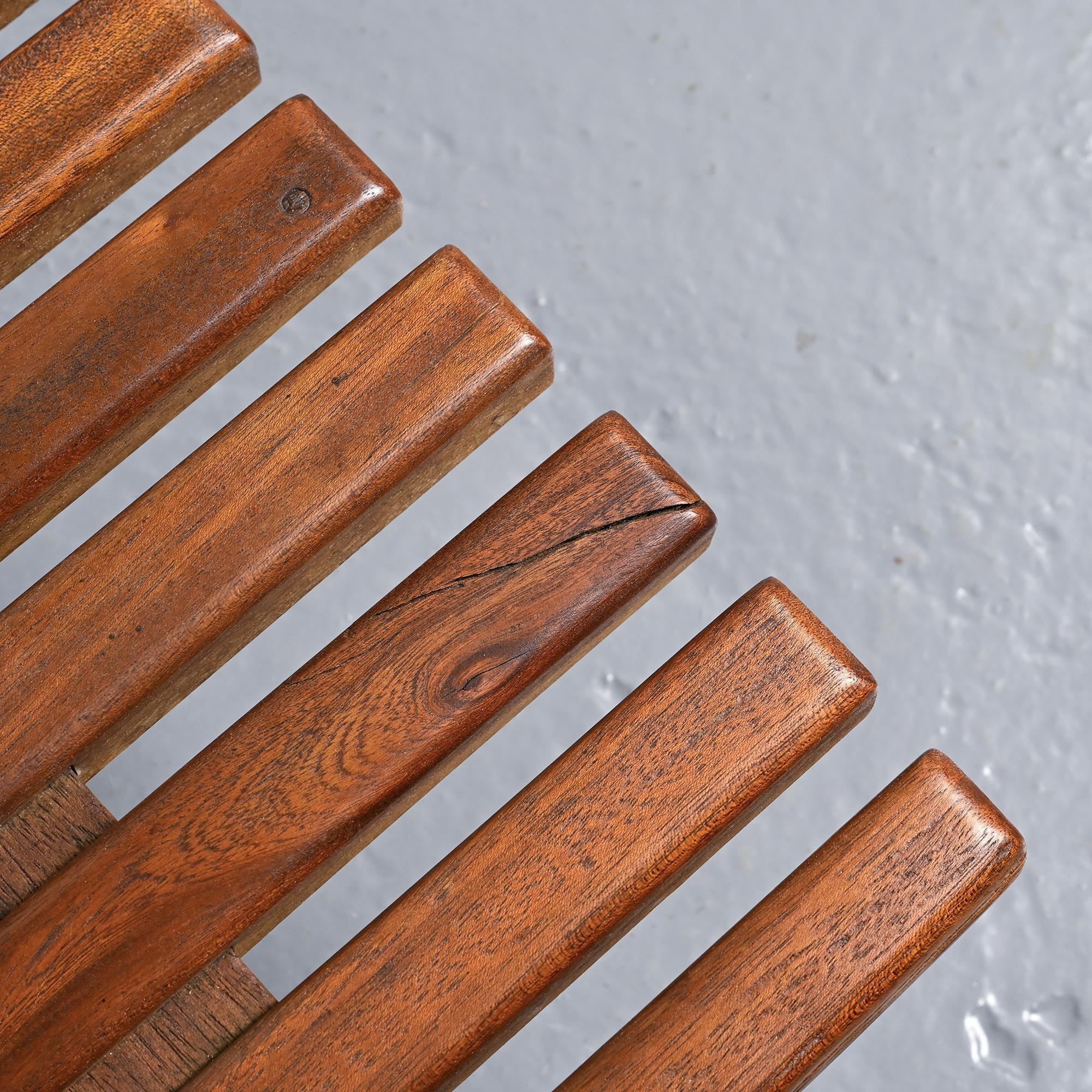 Cansado bench in mahogany by Charlotte Perriand, circa 1962.