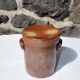 Trio of stoneware pots with lids