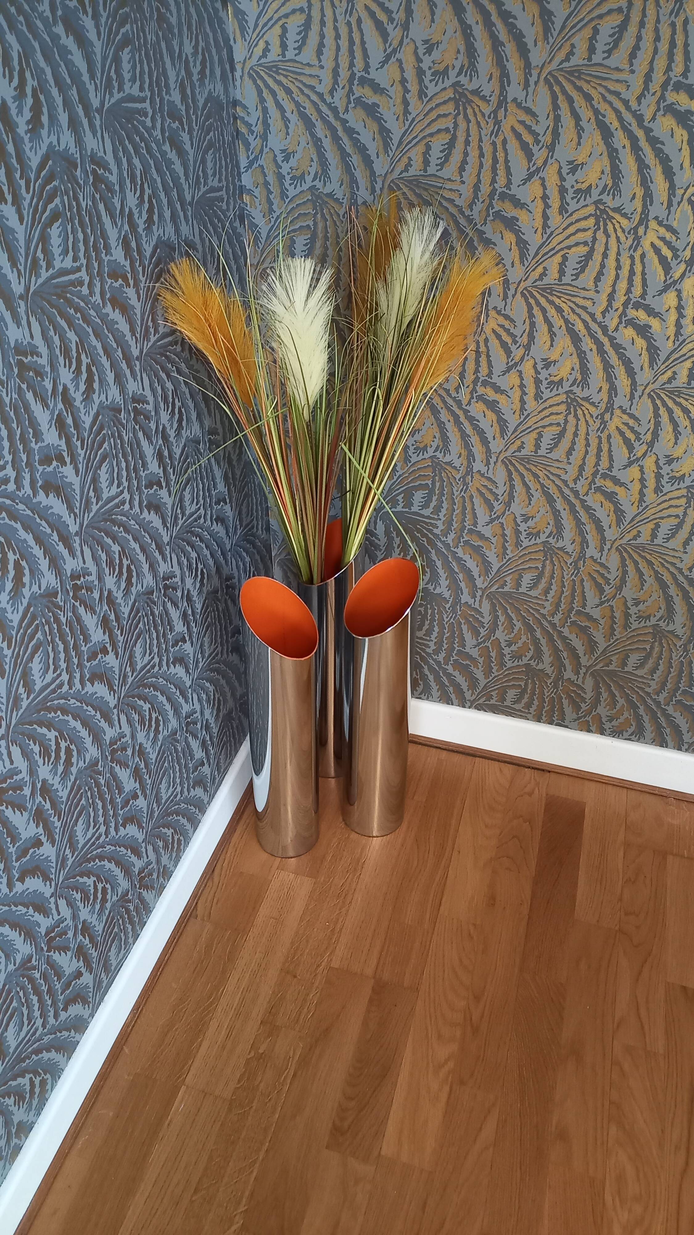 Vintage cylindrical chrome vase from the 1970s.