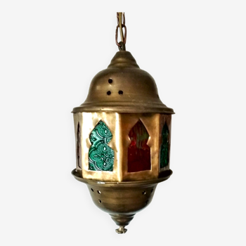 Small octagonal Moroccan brass lantern and colored windows