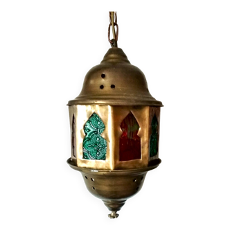 Small octagonal Moroccan brass lantern and colored windows
