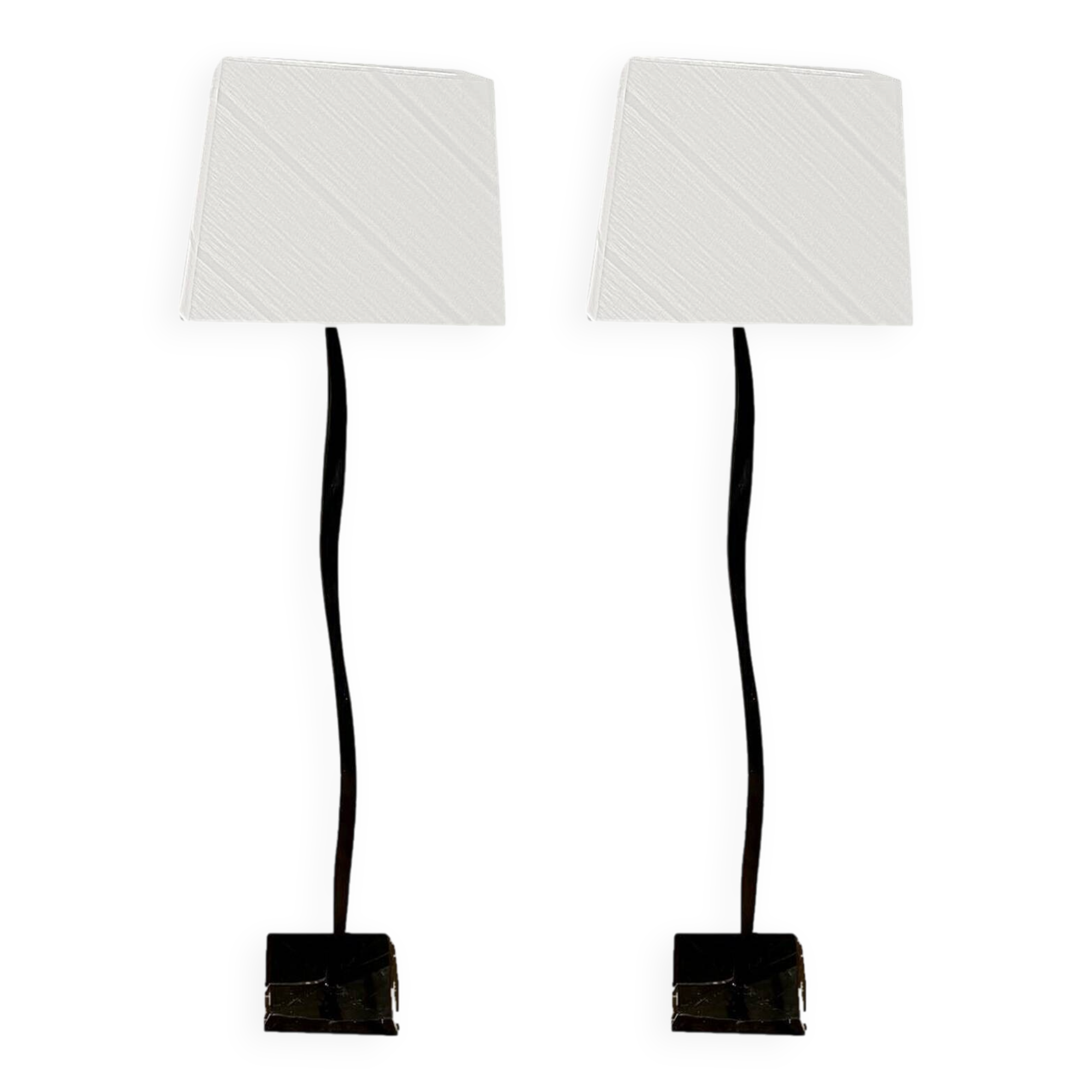 Pair of hammered black metal floor lamps with white shades.
