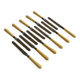 11 antique 19th-century table knives with ivory-colored monogram handles