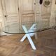 Dining table with glass top and marble base, Ligne Roset.