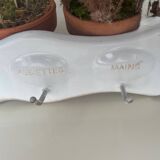 Enamelled sheet metal with inscriptions and hooks