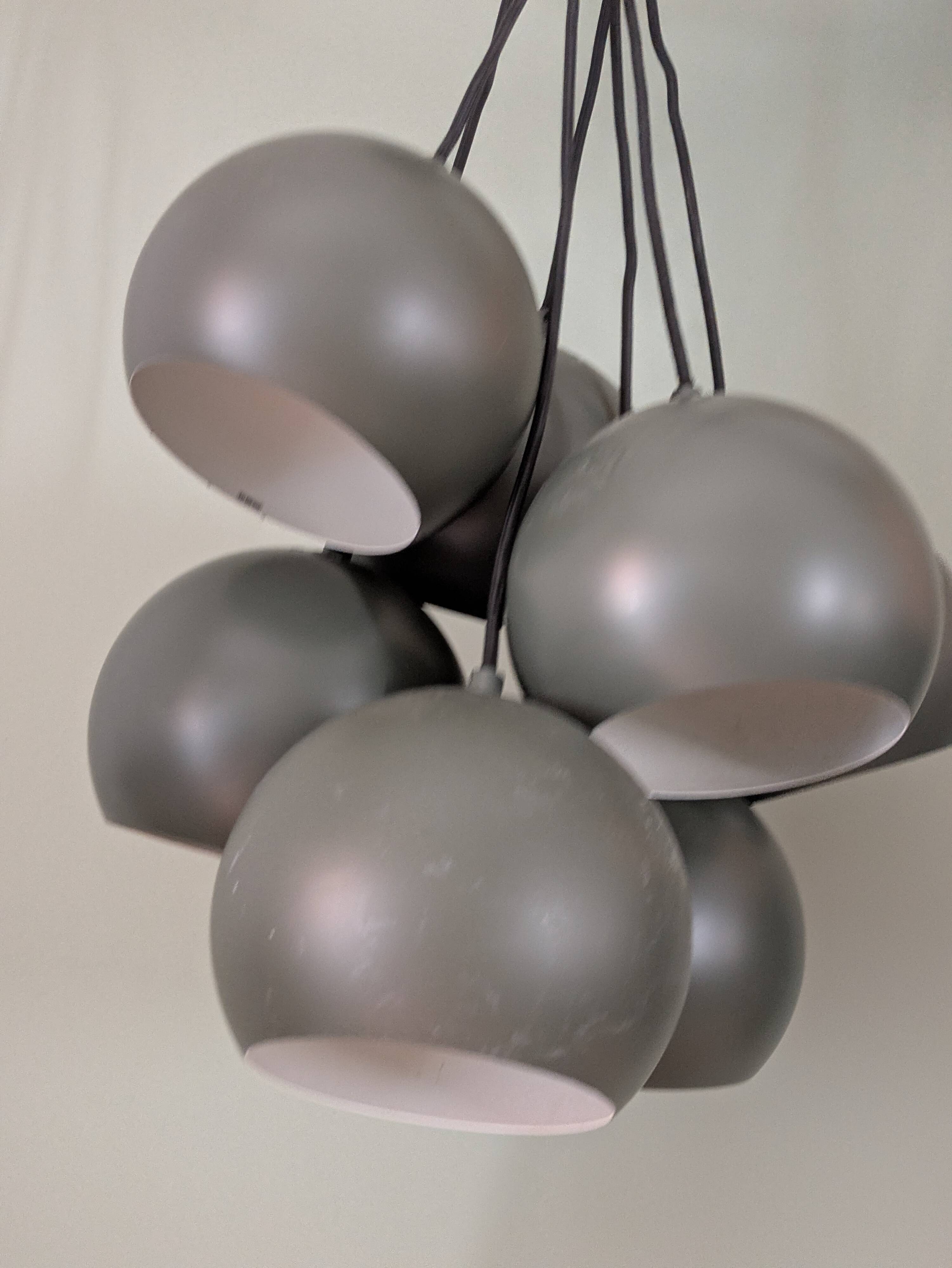 Khaki lamp with 7 bulbs.