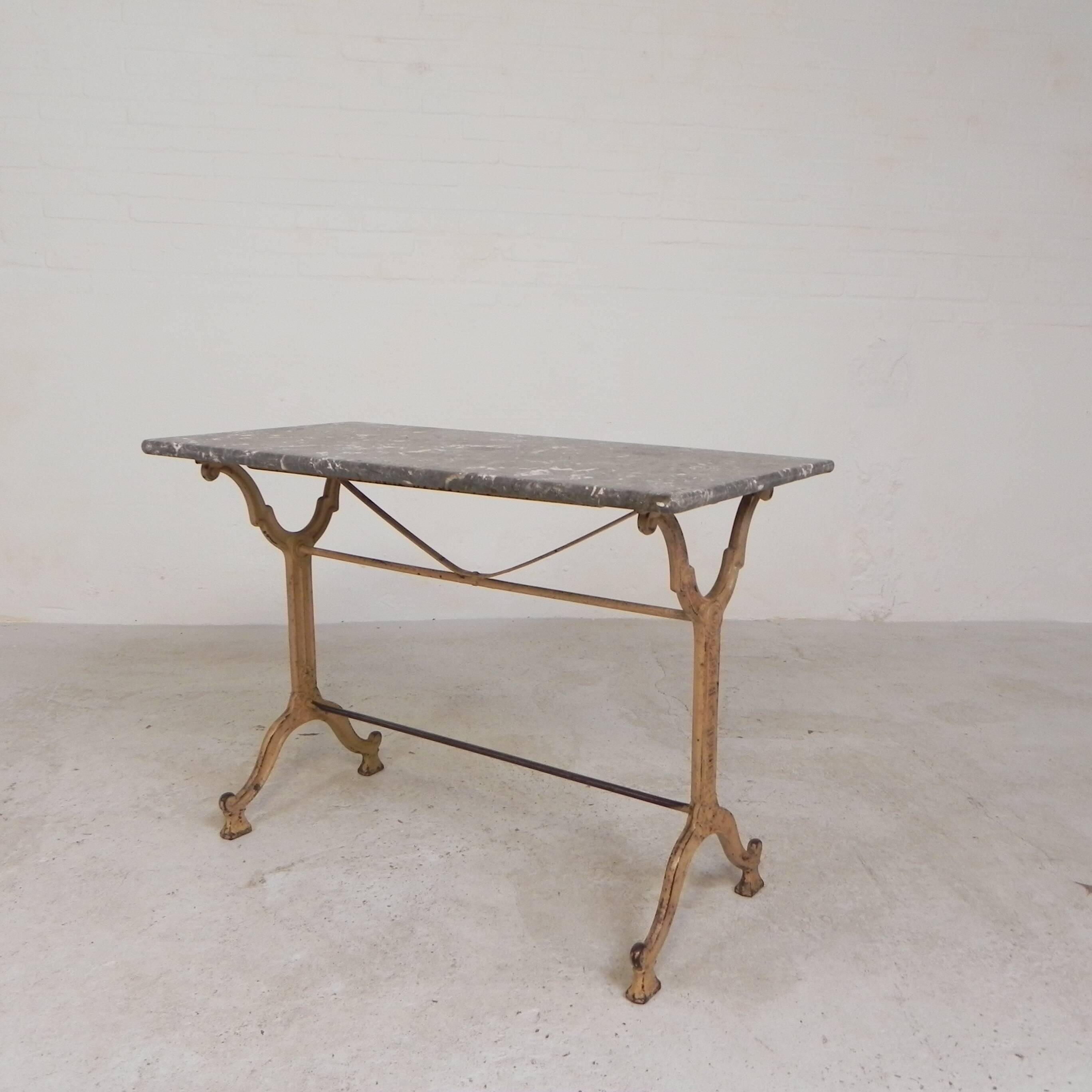 Bistro table marked A.Delail Toulouse in cast iron and marble, 1920