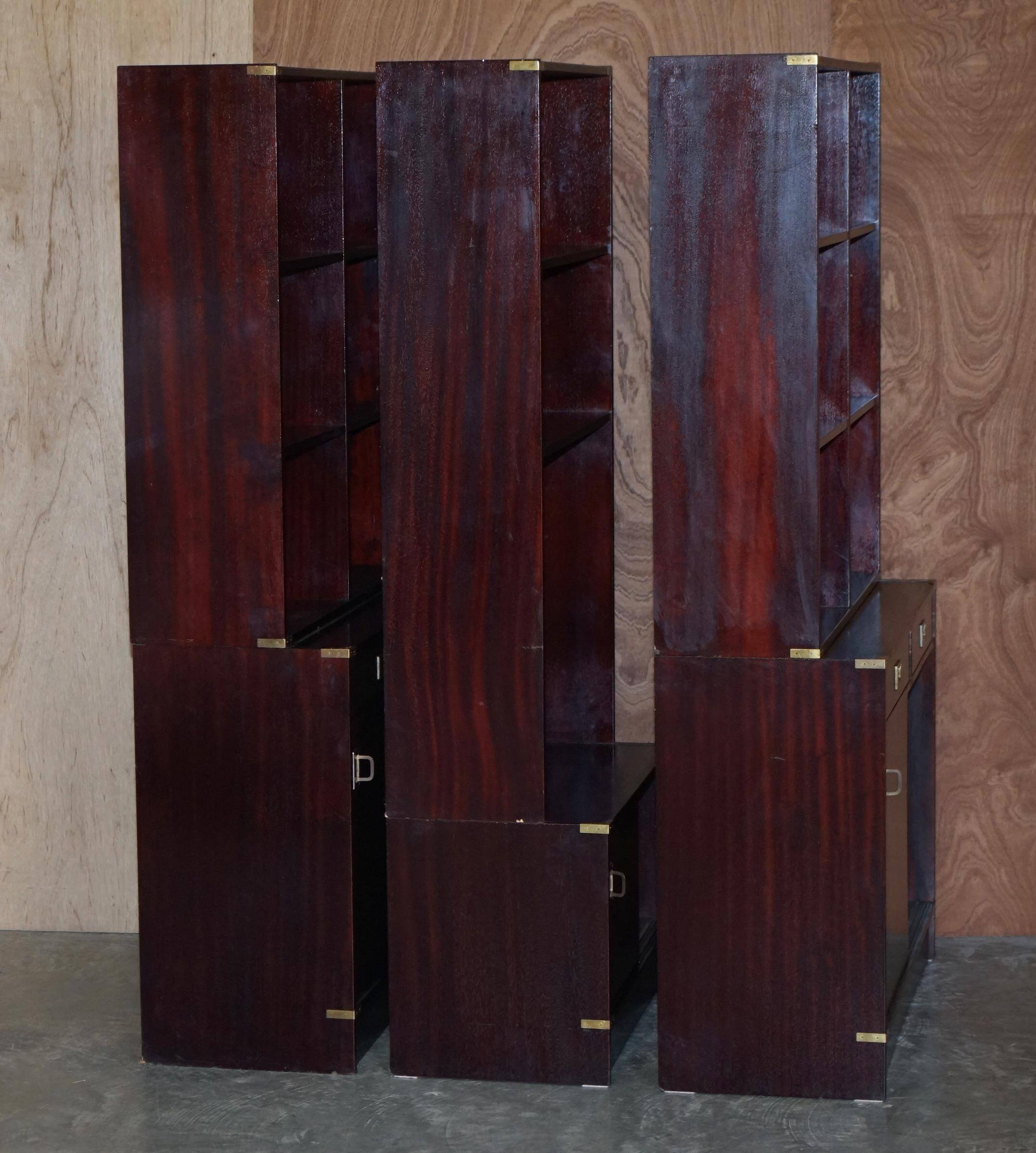 Three vintage style Military Campaign bookshelves, mahogany finish.