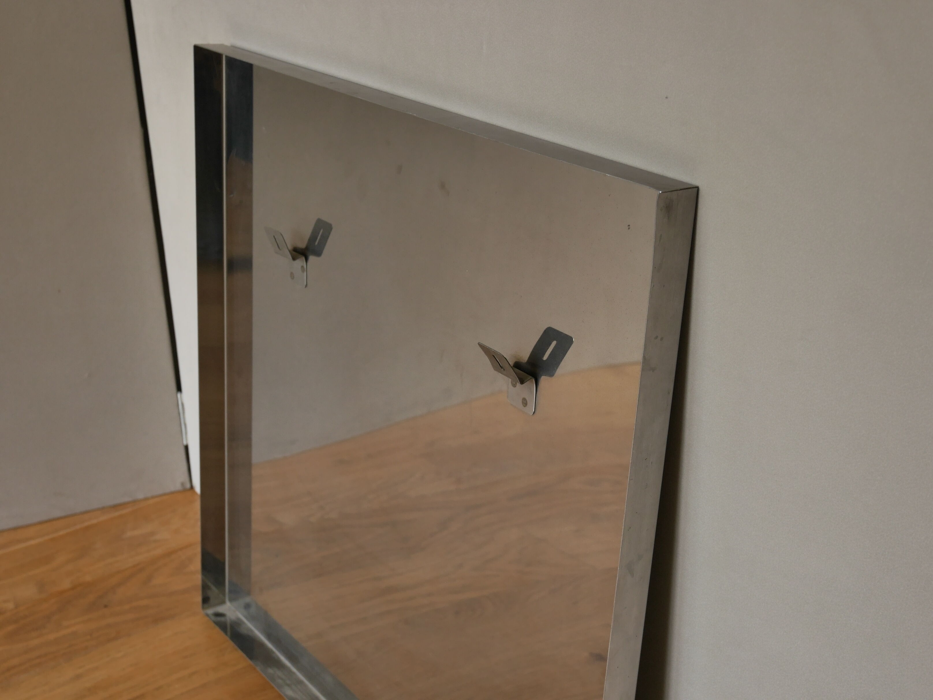 Round mirror with frame in stainless steel of the 1970s 60x60cm
