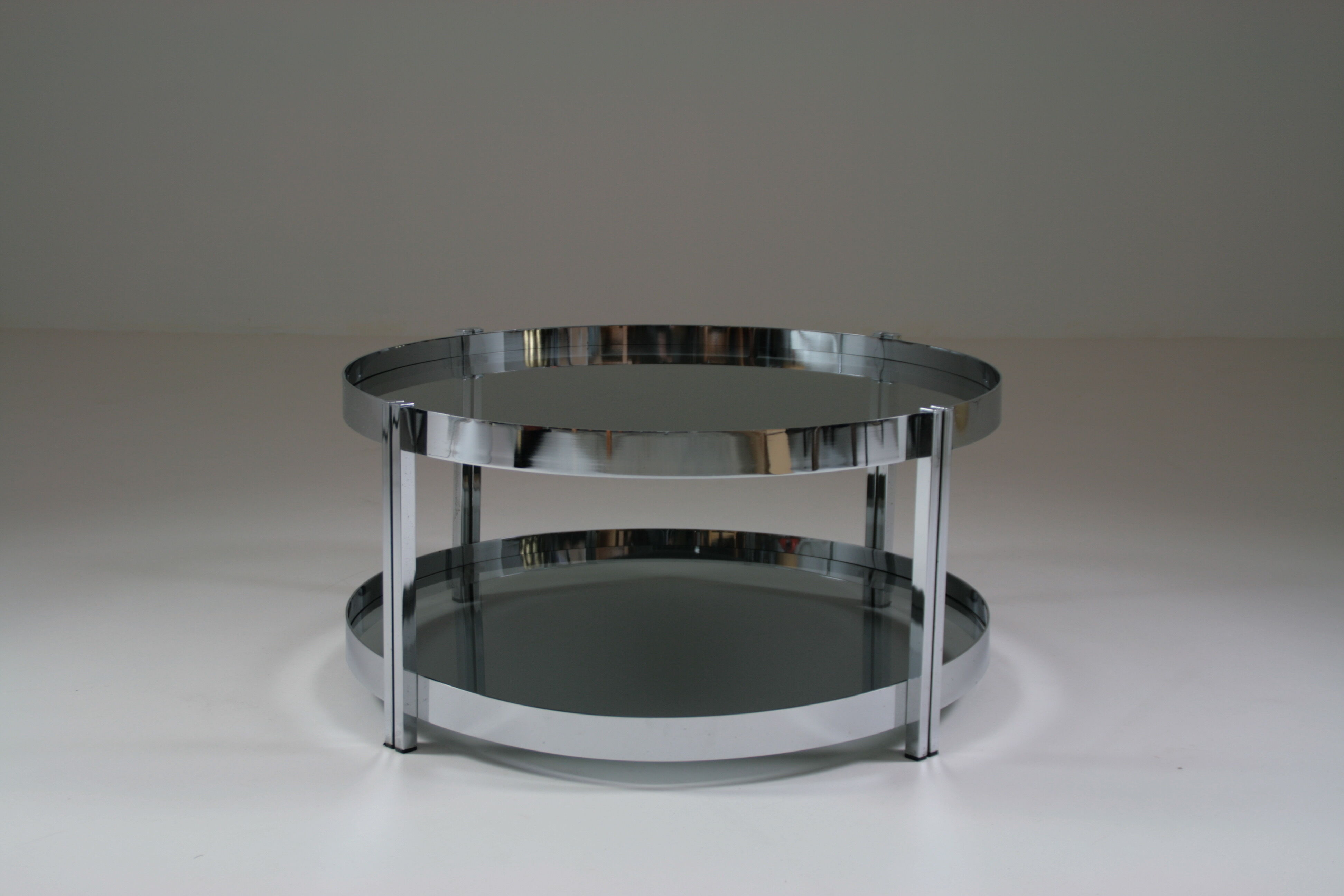 Round chrome-plated metal coffee table and smoked glass tops, France 1970s