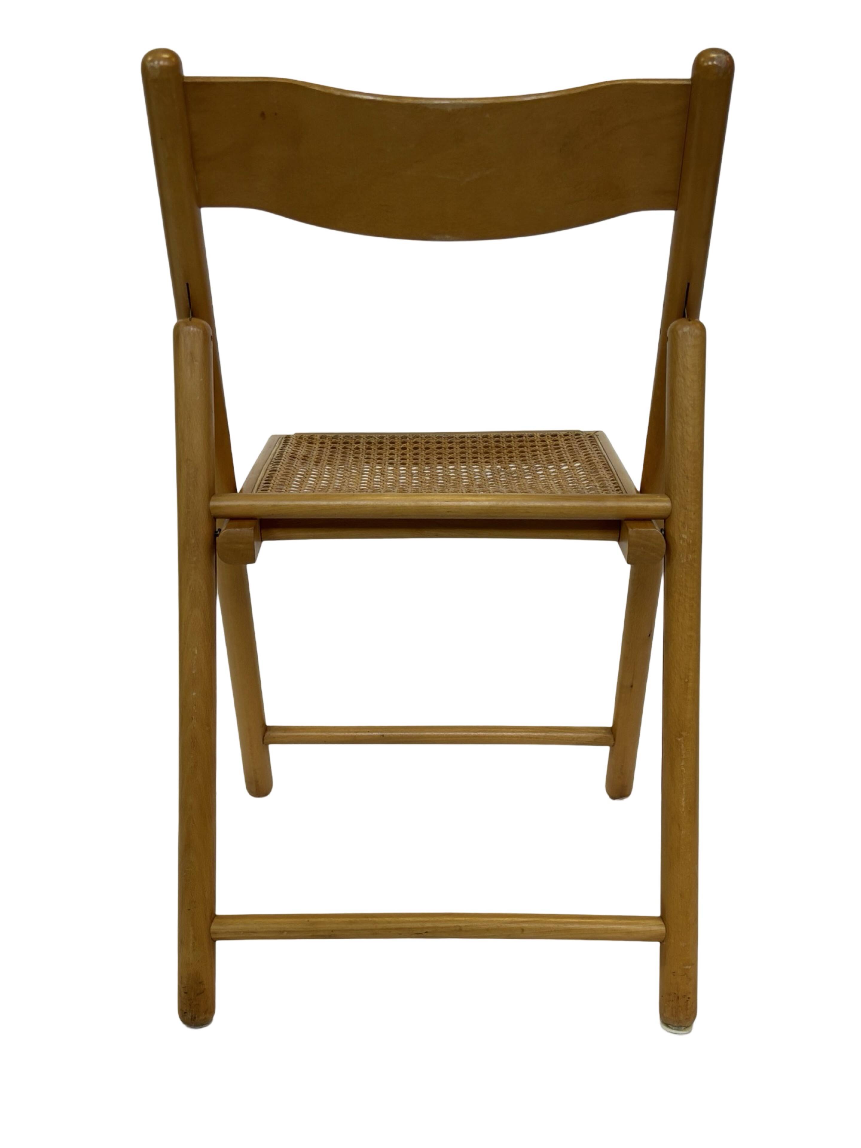 Vintage wooden folding chair with rattan seat 80s minimalist design