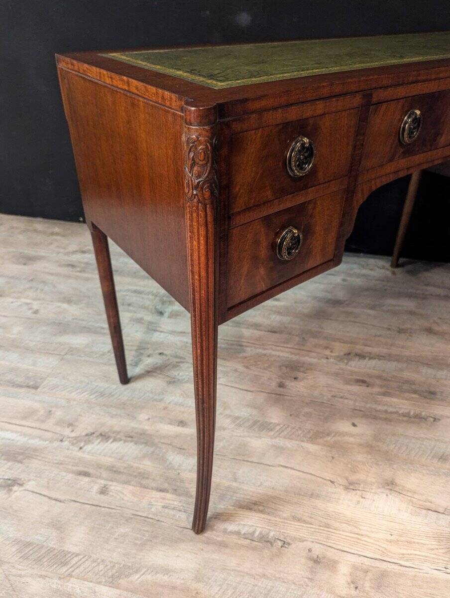 Art Deco desk in curved mahogany veneer.