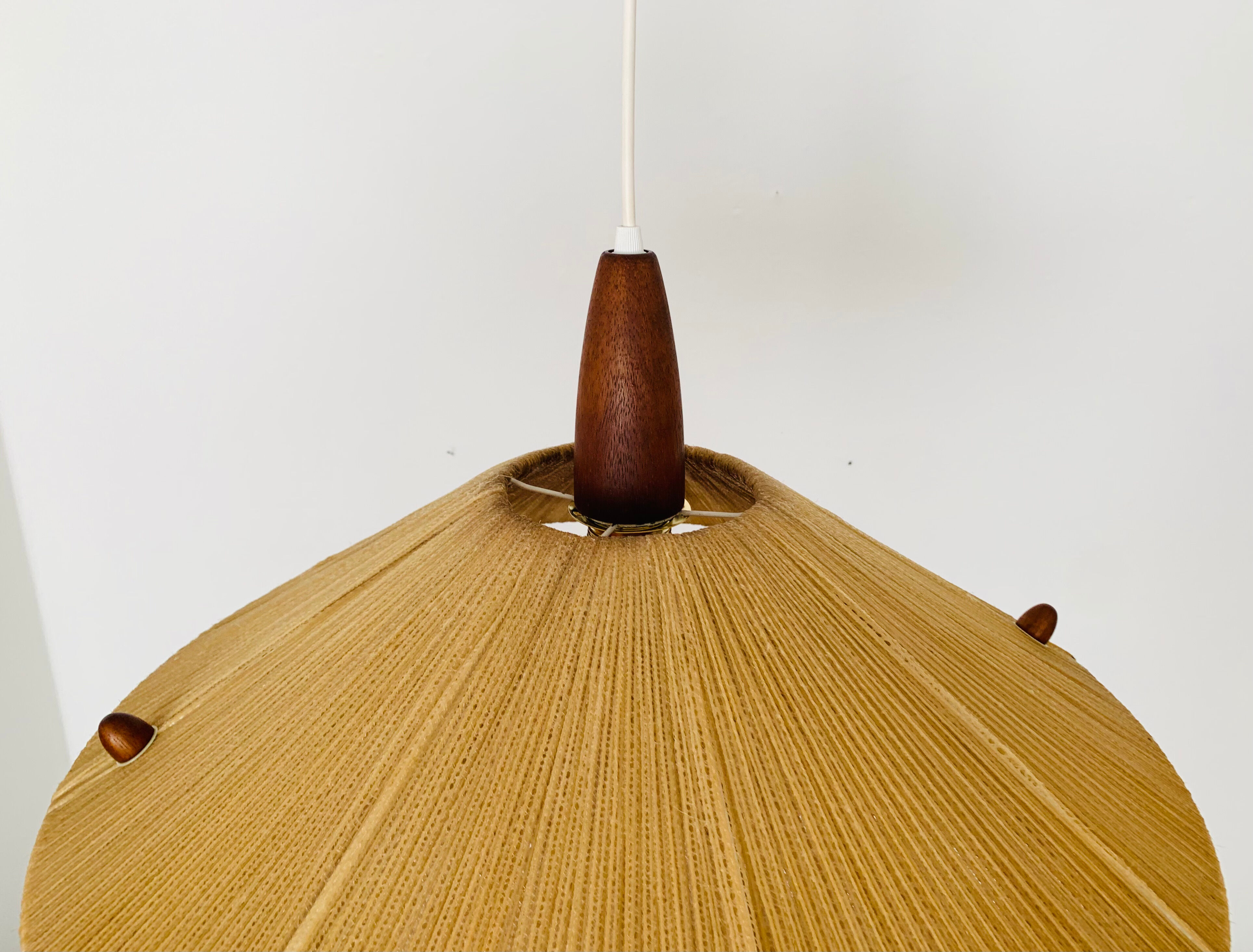 Raffia bast and teak pendant lamp by Temde