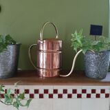 Ancient copper watering can
