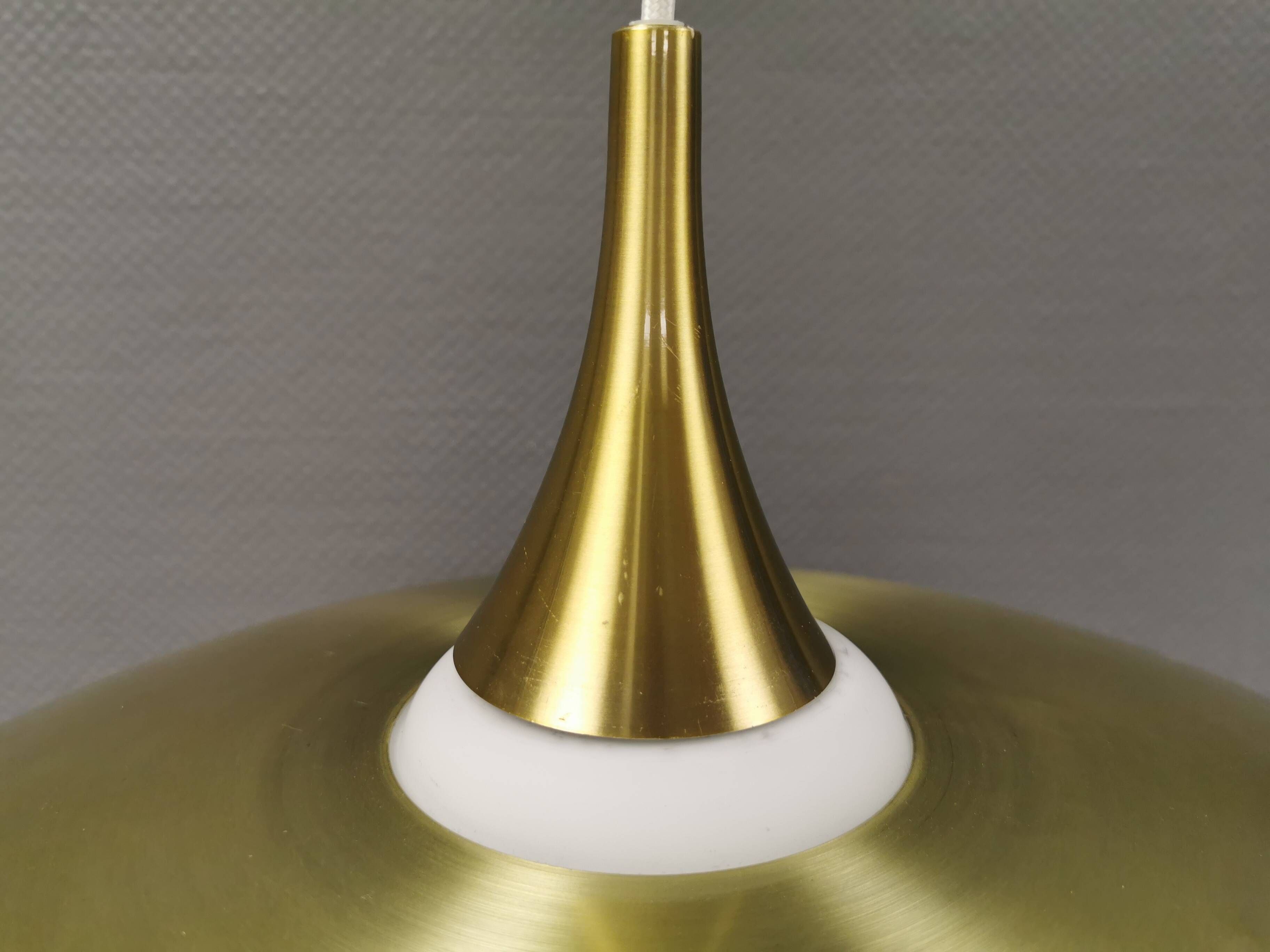 Hanging lamp, from the 1970s in matte white glass and brass colored metal.