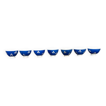 7 mini coffee bowls with a blue polka dot pattern