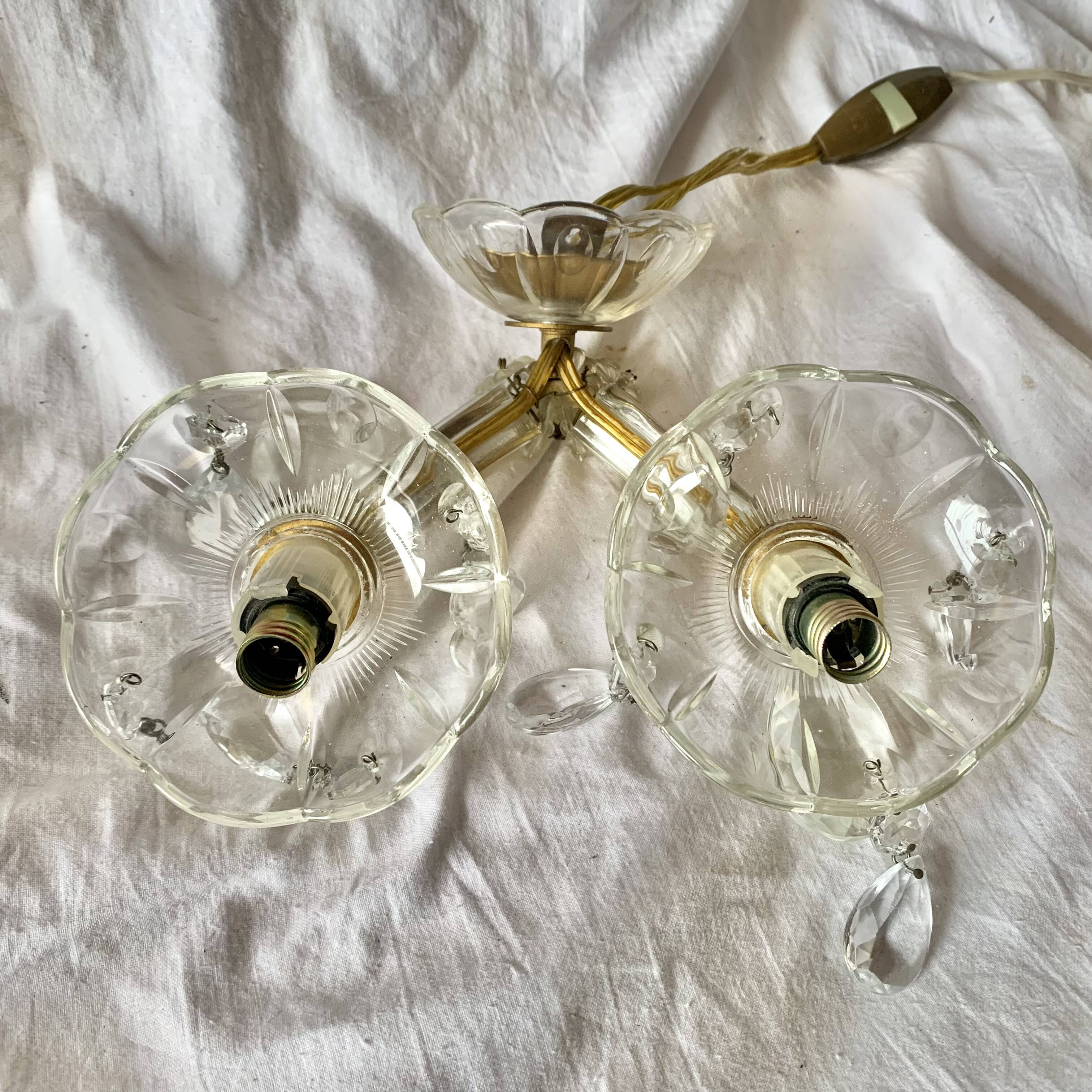 "Pair of vintage glass and brass wall sconces with tassels