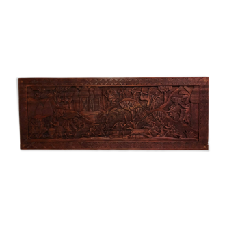 Bas-relief in exotic wood.