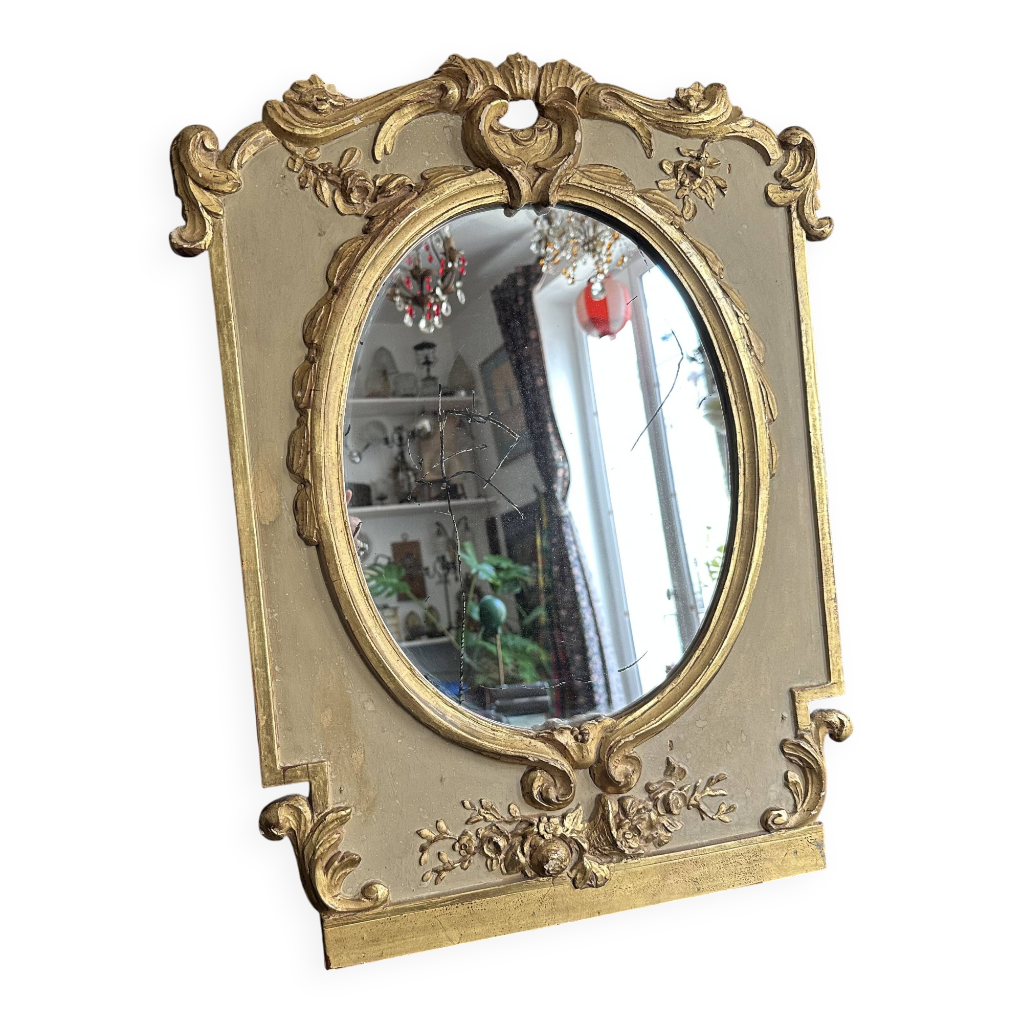 Napoleon III mirror in carved gilded wood, oval mercury glass.